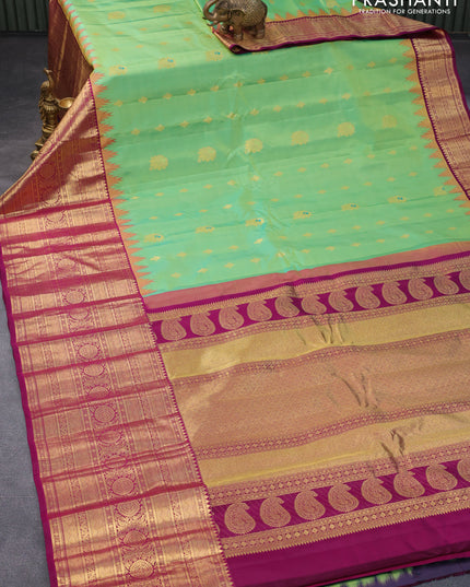 Pure gadwal silk saree light green and purple with zari woven buttas and temple design long zari woven border