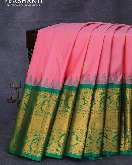 Pure gadwal silk saree light pink and green with zari woven buttas and temple design long zari woven border