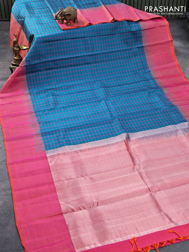 Pure soft silk saree teal blue0 and dual shade of pinkish orange with allover checked pattern and silver zari woven simple border