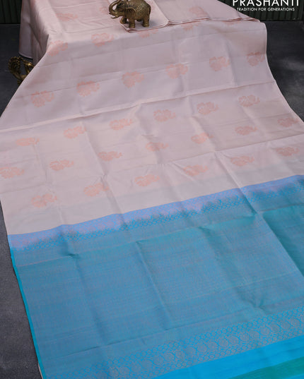 Pure soft silk saree pastel peach shade and dual shade of teal blue with copper zari woven floral buttas in borderless style