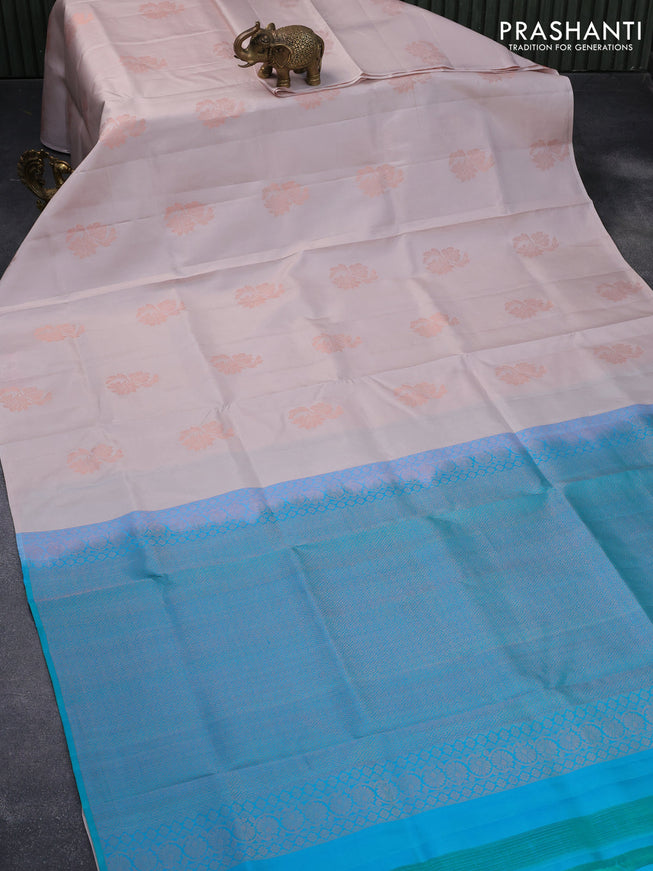 Pure soft silk saree pastel peach shade and dual shade of teal blue with copper zari woven floral buttas in borderless style