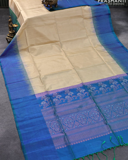 Pure soft silk saree sandal and dual shade of bluish green with plain body and zari checked border
