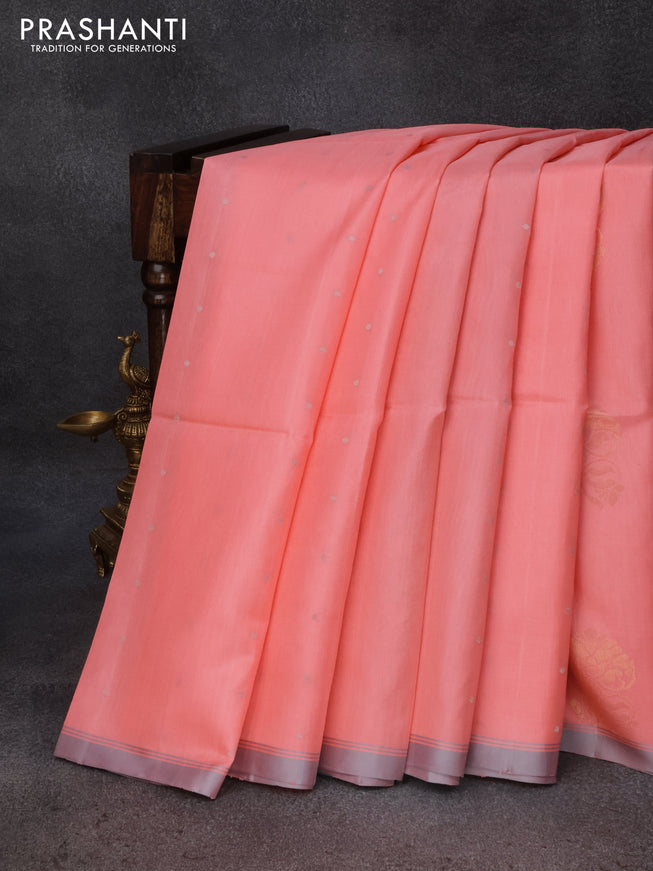 Pure soft silk saree peach pink and pastel grey with allover zari woven buttas ad simple border