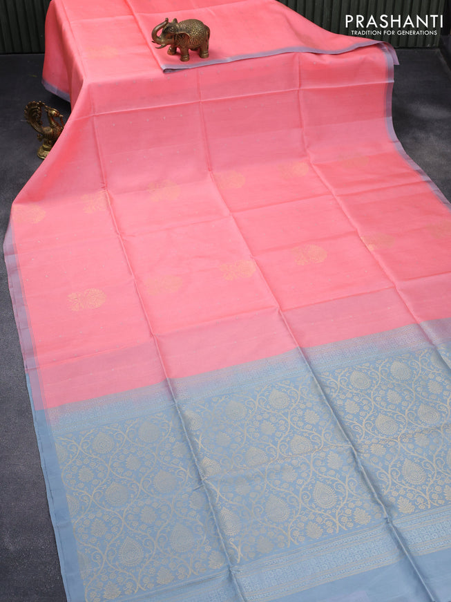 Pure soft silk saree peach pink and pastel grey with allover zari woven buttas ad simple border