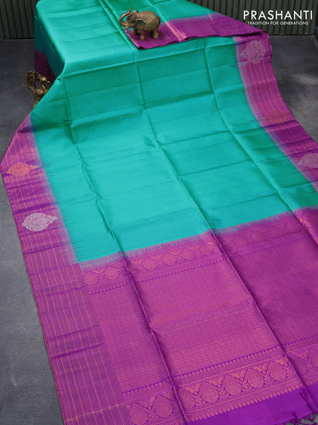 Pure soft silk saree teal blue and purple with allover zari weaves and copper zari woven border