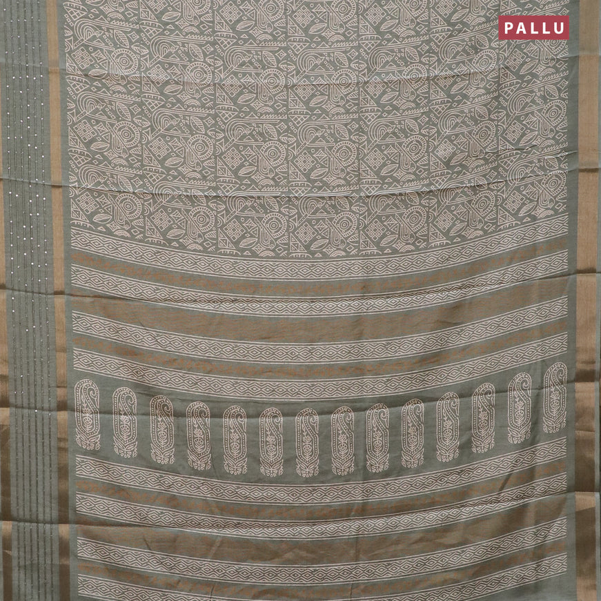 Semi dola saree pastel green shade with allover prints and zari woven sequin work border