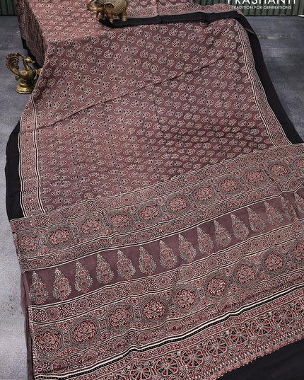 Modal silk saree coffee brown and black with allover floral butta prints and ajrakh printed pallu
