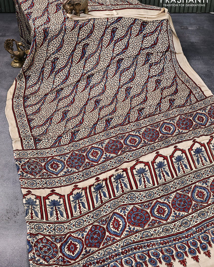 Modal silk saree cream with allover ajrakh prints and printed border