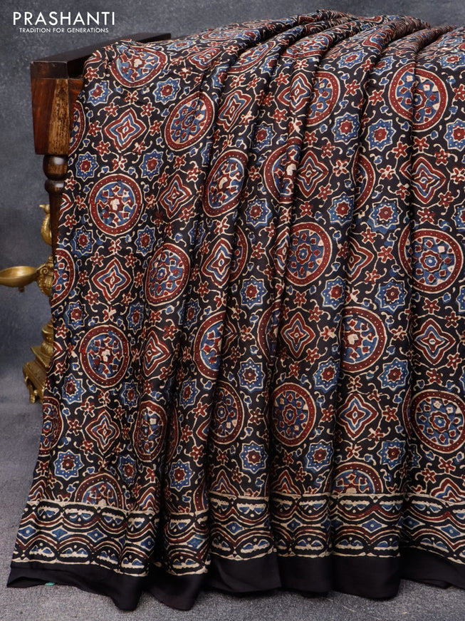 Modal silk saree black with allover ajrakh prints in borderless style