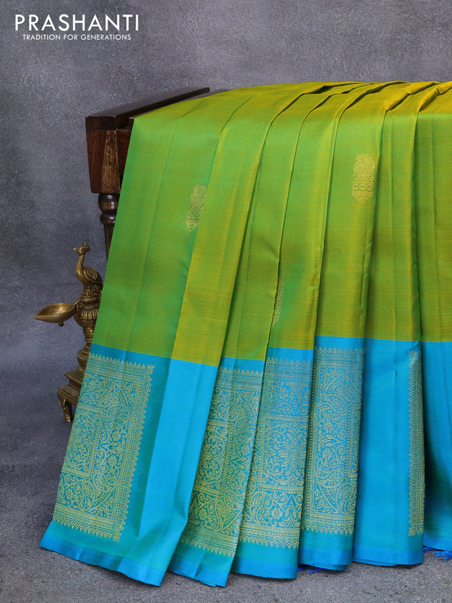 Pure kanjivaram silk saree dual shade of yellowish green and dual shade of teal blue with zari woven buttas and zari woven butta border