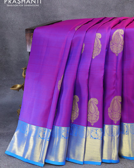 Pure kanjivaram silk saree dual shade of purple and cs blue with zari woven paisley buttas and rich zari woven border