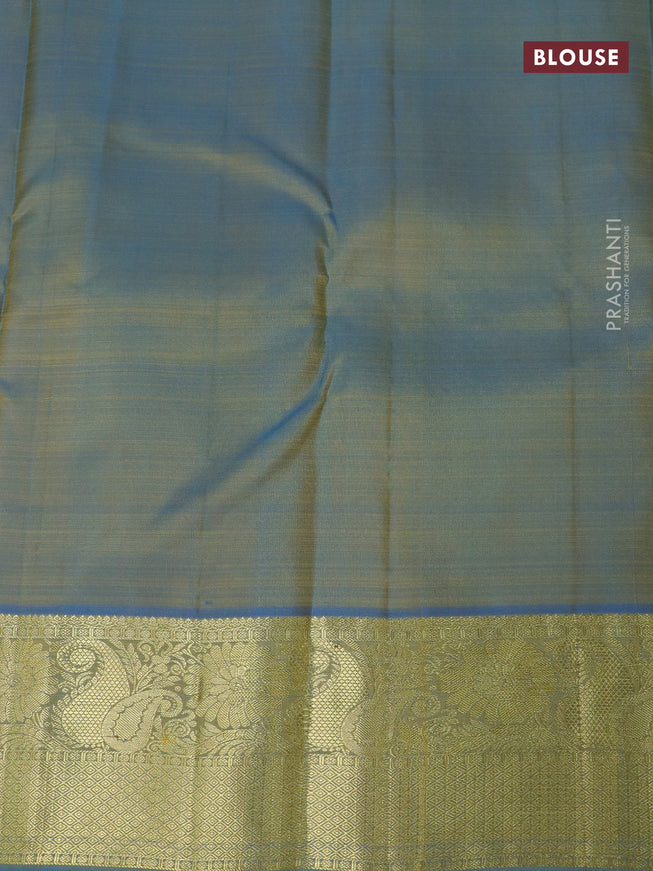 Pure kanjivaram silk saree dual shade of yellowish purple and cs blue with zari woven buttas and zari woven border