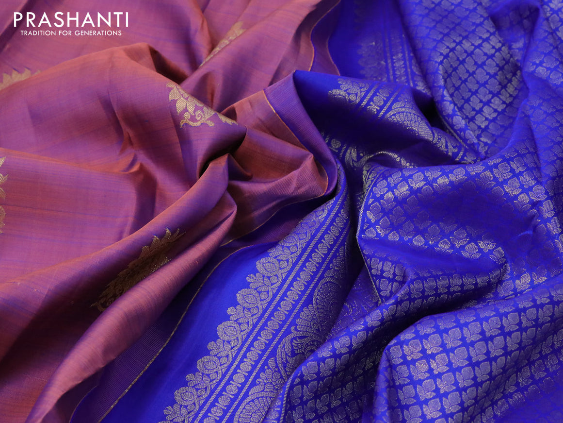 Pure kanjivaram silk saree dual shade of peach pink and blue with zari woven floral buttas and zari woven border