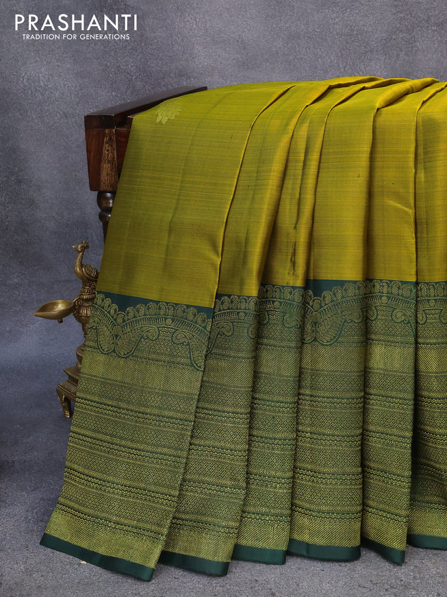 Pure kanjivaram silk saree dual shade of mustard and dark green with peacock zari woven buttas and long rich zari woven border