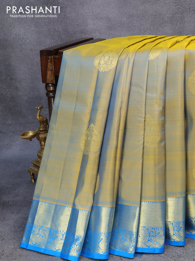 Pure kanjivaram silk saree dual shade of yellow and cs blue with zari woven buttas and annam zari woven border