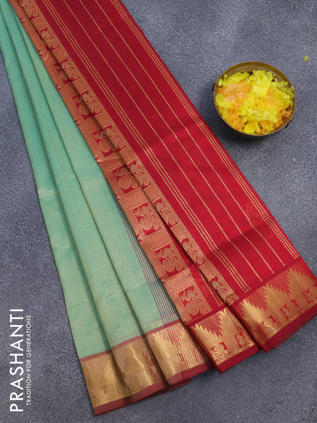 Silk cotton saree dual shade of pastel green and maroon with zari woven paisley buttas and annam & temple zari woven border