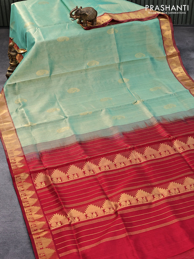 Silk cotton saree dual shade of pastel green and maroon with zari woven paisley buttas and annam & temple zari woven border