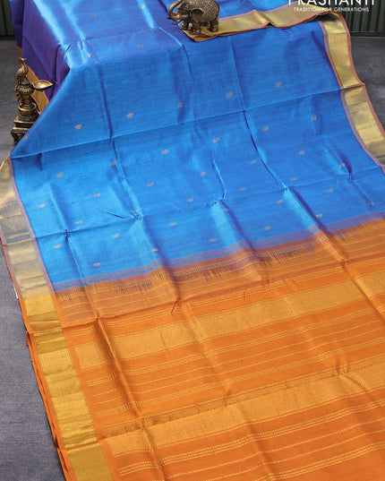 Silk cotton saree blue and dark mustard with leaf zari woven buttas and zari woven border