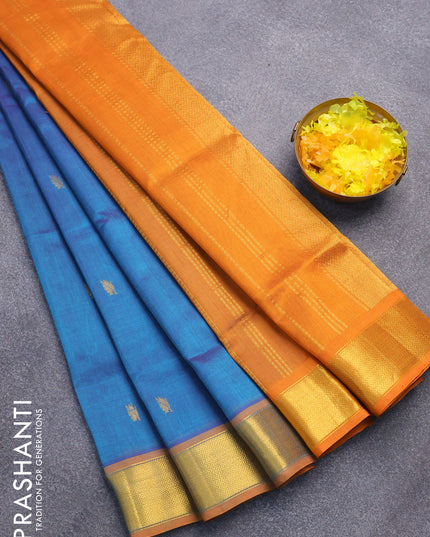 Silk cotton saree dual shade of peacock blue and mustard yellow with leaf zari woven buttas and zari woven border