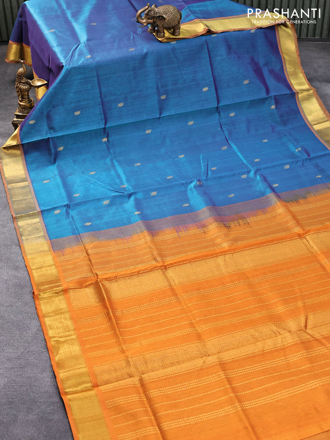 Silk cotton saree dual shade of peacock blue and mustard yellow with leaf zari woven buttas and zari woven border