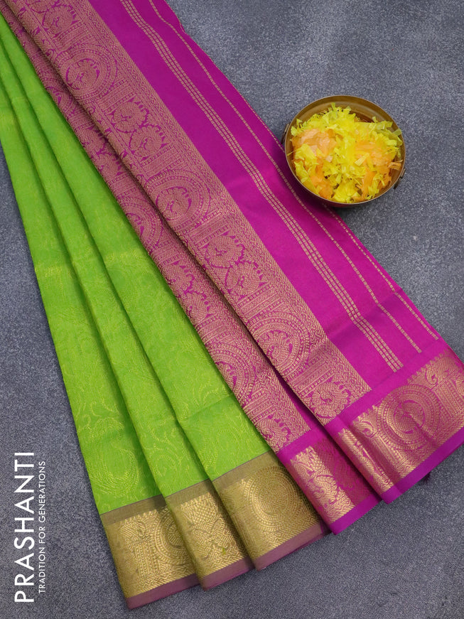 Silk cotton saree light green and purple with allover self emboss jaquard and zari woven border