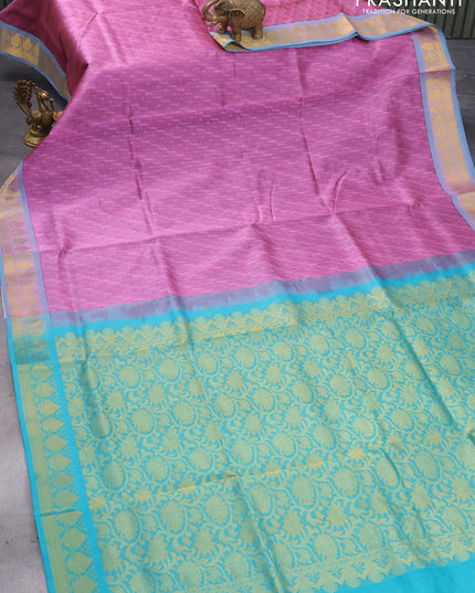 Silk cotton saree mauve pink and teal green with allover self emboss jaquard and zari woven border