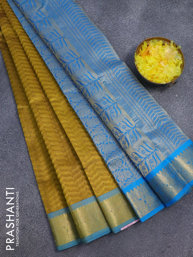 Silk cotton saree dark mustard and cs blue with allover self emboss jaquard and zari woven border