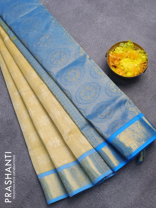 Silk cotton saree pale yellow and cs blue with allover self emboss jaquard and annam & elephant zari woven border