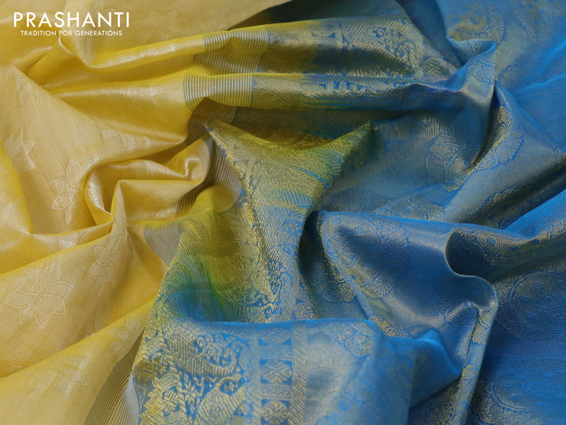 Silk cotton saree pale yellow and cs blue with allover self emboss jaquard and annam & elephant zari woven border