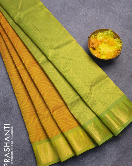 Silk cotton saree dual shade of mustard and light green with allover self emboss jaquard and zari woven border