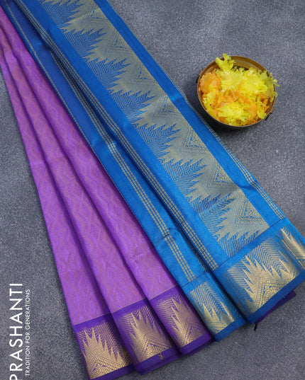 Silk cotton saree dual shade of violet and cs blue with allover self emboss jaquard and temple design zari woven border
