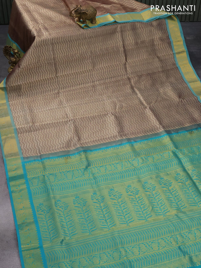 Silk cotton saree beige and teal blue with allover self emboss jaquard and zari woven border