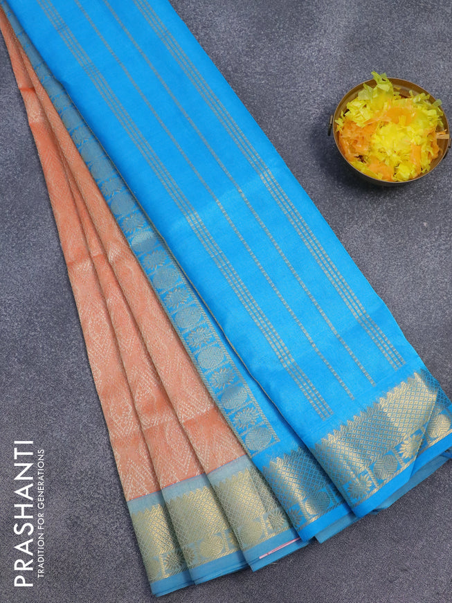 Silk cotton saree pale orange and cs blue with allover self emboss jaquard and rich zari woven border