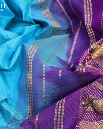 Silk cotton saree blue and violet with allover self emboss jaquard and zari woven border