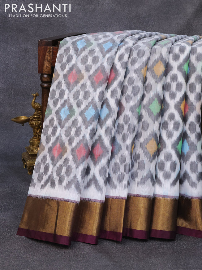 Ikat silk cotton saree offwhite and wine shade with allover ikat weaves and zari woven border