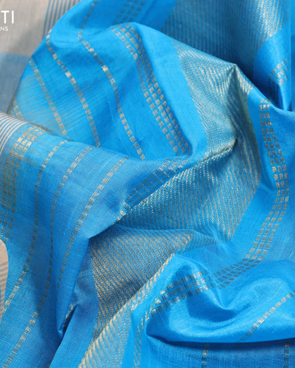 Silk cotton saree sandal and cs blue with allover paalum pazhamum checks & zari buttas and annam zari woven border