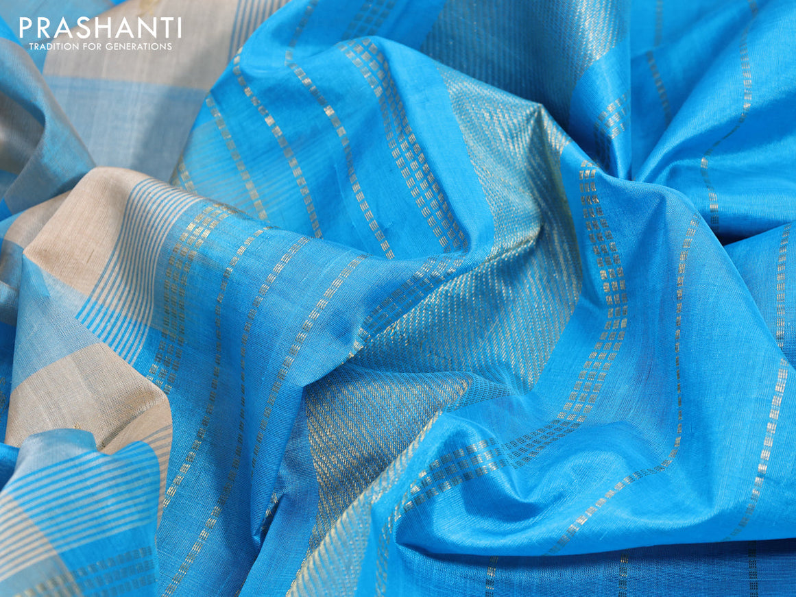 Silk cotton saree sandal and cs blue with allover paalum pazhamum checks & zari buttas and annam zari woven border