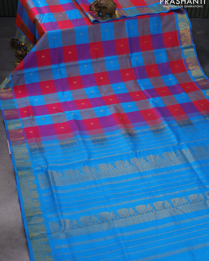 Silk cotton saree dual shade of pinkish orange and cs blue with allover paalum pazhamum checks & zari buttas and annam zari woven border