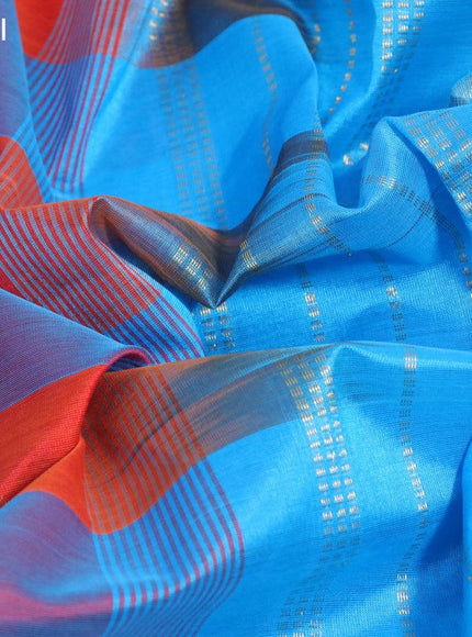 Silk cotton saree orange and cs blue with allover paalum pazhamum checks & zari buttas and annam zari woven border