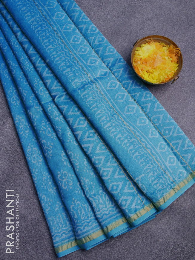 Chanderi bagru saree cs blue with allover butta prints and zari woven piping border