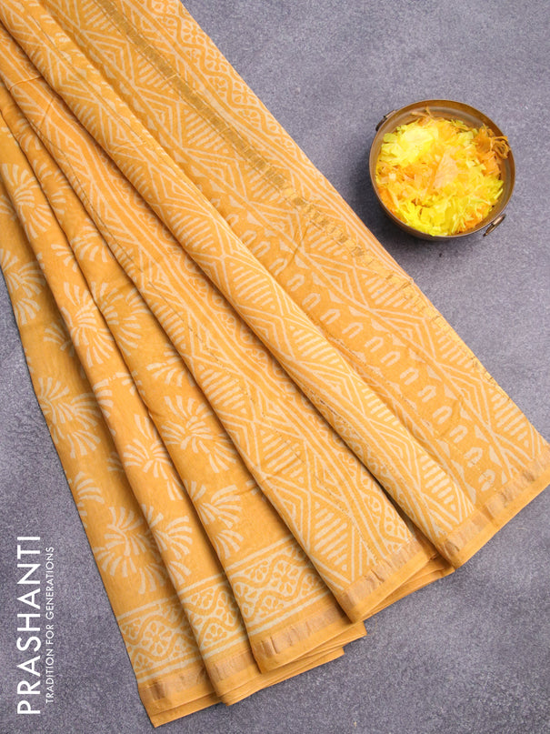 Chanderi bagru saree yellow with allover butta prints and zari woven piping border