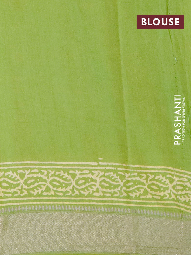 Semi gadwal saree light green with allover prints and zari woven border