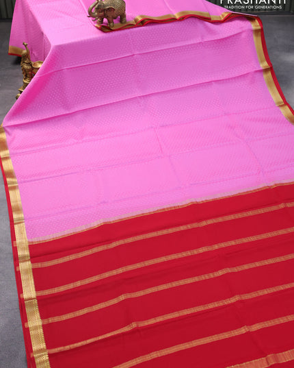 Pure mysore crepe silk saree light pink and red with allover self emboss and zari woven border