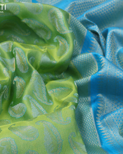 Pure kanjivaram tissue silk saree dual shade of light green and blue with allover zari woven paisley butta weaves and rich zari woven border