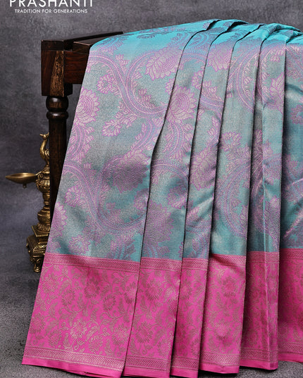Pure kanjivaram tissue silk saree dual shade of teal blue and pink with allover zari woven floral brocade weaves and rich floral zari woven border