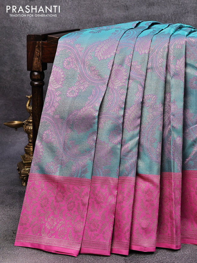 Pure kanjivaram tissue silk saree dual shade of teal blue and pink with allover zari woven floral brocade weaves and rich floral zari woven border