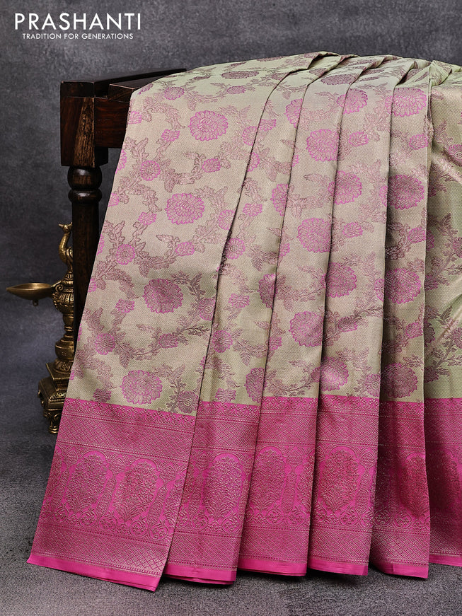 Pure kanjivaram tissue silk saree mild pista green and pink with allover zari woven floral brocade weaves and rich zari woven border