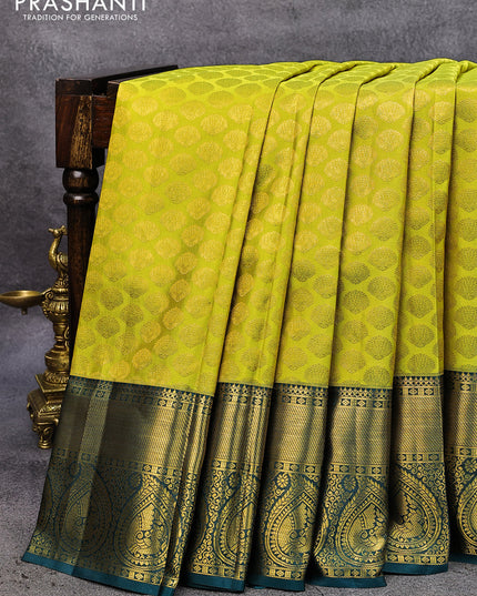 Pure kanjivaram silk saree lime green and peacock green with allover zari woven butta weaves and rich zari woven paisley border