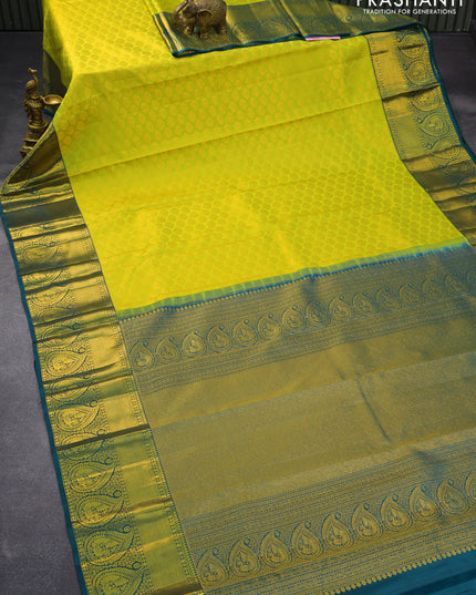 Pure kanjivaram silk saree lime green and peacock green with allover zari woven butta weaves and rich zari woven paisley border
