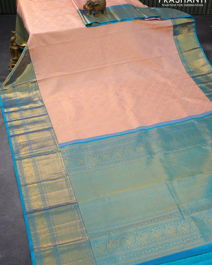Pure kanjivaram silk saree mild peach shade and dual shade of blue with allover zari woven brocade weaves and long rich zari woven aannam border